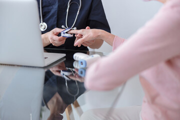 Professional pediatrician visiting old woman at home