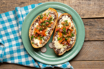 Molletes with fresh sauce and cheese. Mexican food