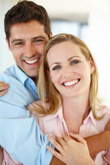 Fototapeta premium He makes being happy so easy. Closeup shot of a couple smiling happily indoors.