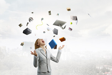 Young pretty businesswoman juggling with business items