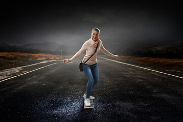Fototapeta na wymiar Young woman riding her skateboard