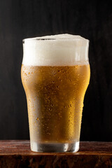 A glass cup of delicious beer.