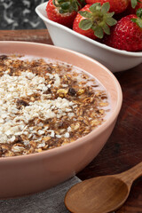 Strawberry yogurt with granola and quinoa.