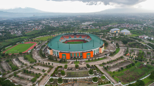 Aerial View of The largest stadium of Pakansari Bogor from drone and noise cloud. Bogor, Indonesia