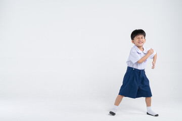 Fototapeta na wymiar Asian boy in Thai official elementary school uniform