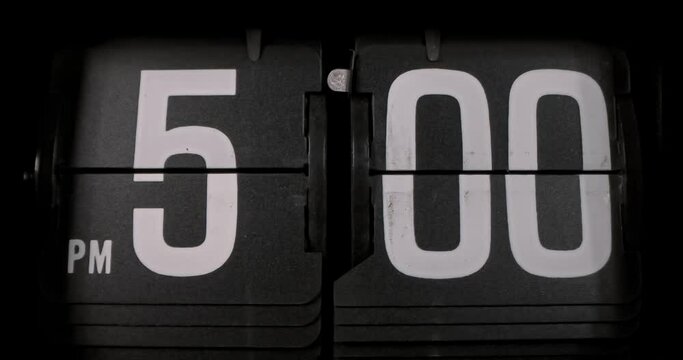 Retro flip clock switching from 4:59pm to 5:00pm; 1000fps slow motion, end of work day theme