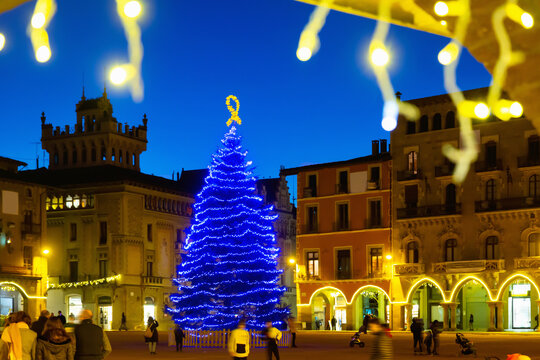 Illuminated streets of old town of Spanish Vic city festively decorated for Christmas
