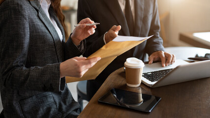  Team work process. Photo young business crew working with new startup project. Project managers meeting. Analyze plans, papers. At office.