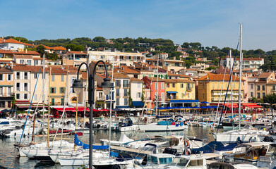 View on boats in marina in bay of Cassis resort town on sunny day at Provence, France