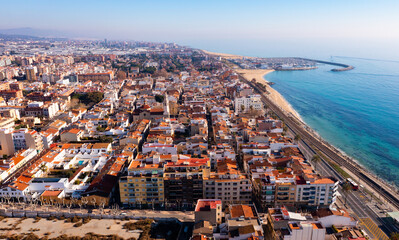 Aerial photo of Premia de Mar with view of residential buildings along Mediterranean Sea coast, Catalonia, Spain. - obrazy, fototapety, plakaty
