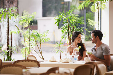 Table for two. A couple on a romantic date at a fine dining restaurant.