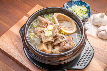 Beef bone soup or Seolleongtang The Most COMFORTING Korean food Served with kimchi, steamed rice, a popular Korean dish.