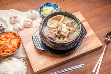 Beef bone soup or Seolleongtang The Most COMFORTING Korean food Served with kimchi, steamed rice, a popular Korean dish.