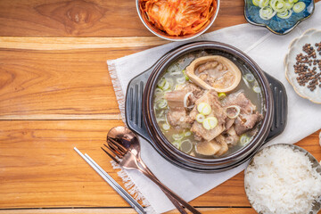 Beef bone soup or Seolleongtang The Most COMFORTING Korean food Served with kimchi, steamed rice, a popular Korean dish.