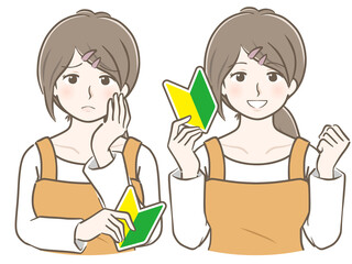 初心者マークを持つエプロン姿の若い女性