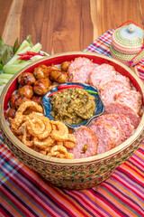 Northern Thai Sausage with Chilli Dips, sour pork and crispy pork rindserved with fresh vegetables and fresh chili, Asian style food. 