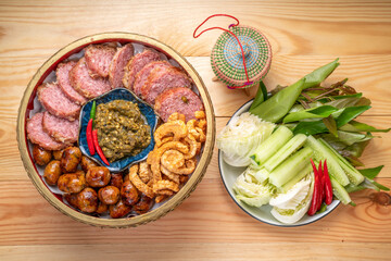 Northern Thai Sausage with Chilli Dips, sour pork and crispy pork rindserved with fresh vegetables and fresh chili, Asian style food. 