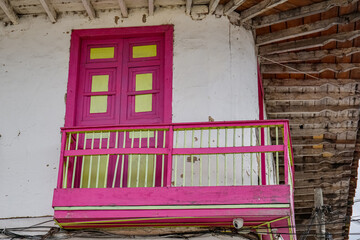 Traditional colorful painted balcony and door under the roof of of a two story house, Salento. Columbia
