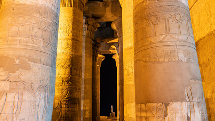 Colonnade in the ancient temple of Kom Ombo. Close-up.  Carvings and hieroglyphs are visible on the...