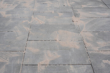 sand lying on paving plates for filling