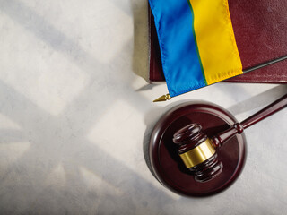 Judge's gavel on the book and the flag of Ukraine.Justice.The Hague court.Stopping the war and justice.Russian invasion.For news and media