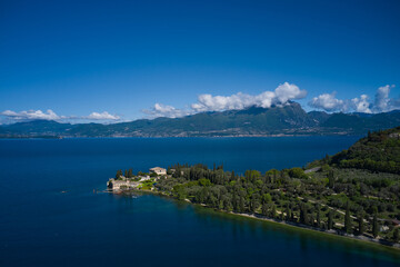 Aerial view of Parco Baia delle Sirene, Lake Garda, Italy. Panorama of punta san vigilio. Top view of baia delle sirene on the coastline of Lake Garda.