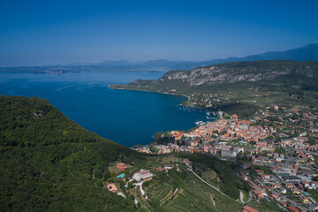 Fototapeta premium Monastery on the Eremo di San Giorgio hill,.Lake Garda, Italy. Aerial view of Eremo di San Giorgio, Bardolino. Aerial panorama Monastery on the hill. Home of Italian monks, lake garda.