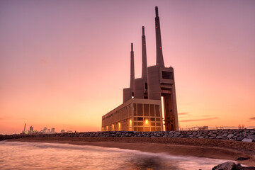 The decommissioned thermal power station at Sand Adria near Barcelona at sunset
