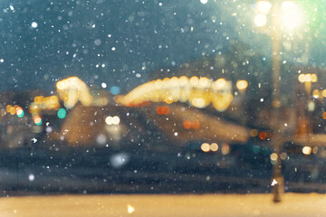 road traffic in a big city on a winter night in heavy snow