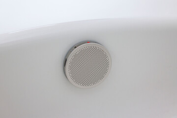 Close-up image of the stainless steel circulation fittings of the bathtub