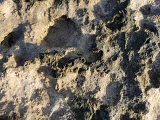 Coast of the Mediterranean Sea, long frozen lava. Background. It looks like an alien landscape.