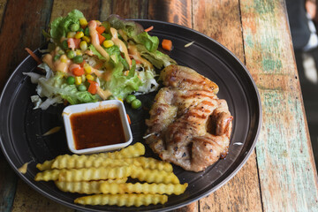 Pork neck steak on a plate ready to eat