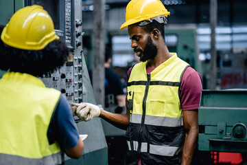 Industrial workers or Technicians using a digital tablet and discussing workshops mechanical maintenance in a factory, Working together, Coordination and Teamwork Concept.