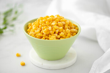 sweet canned corn in a green bowl