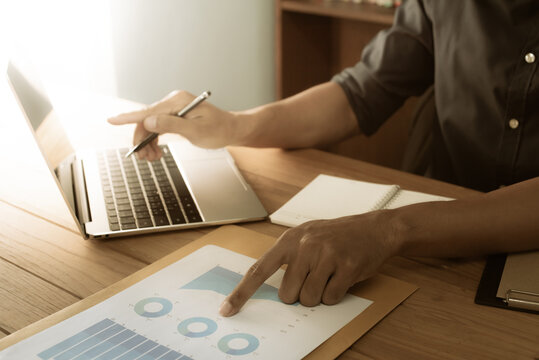 Businessman Working Laptop For New Architectural Project. Generic Design Notebook On The Table. Blurred Background, Horizontal Mockup. Tax Calculate Finance.