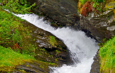 Breathtaking scenery of mountains, galciers and waterfalls in Geirangerfjord during cruising to...
