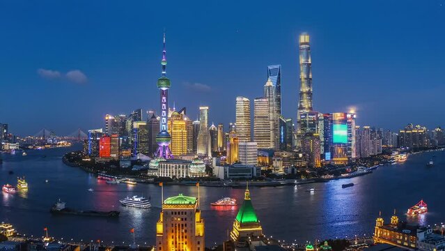 Aerial footage of modern commercial office buildings and skyline in Shanghai at night, China.