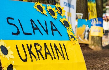 Beautiful yellow and blue painted Ukrainian flag and ribbon during a peaceful demonstration against...