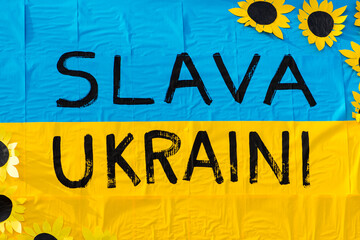 Beautiful yellow and blue painted Ukrainian flag and ribbon during a peaceful demonstration against...