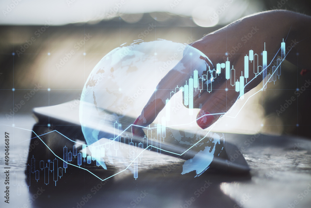 Aufkleber close up of female hand using tablet at desktop with forex chart on blurry background with grid. tra