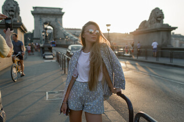 Young beautiful girl in Budapest on the Chain Bridge