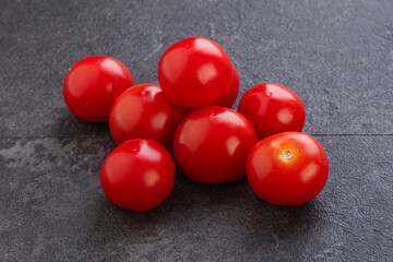Ripe juicy cherry tomatoes heap