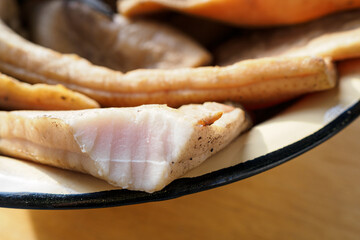 Close-up of smoked bacon in a bowl.