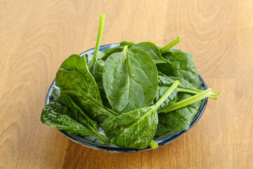 Fresh green spinach leaves in the bowl