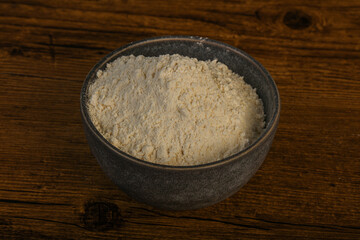 Wheat flour heap in the bowl
