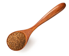 Roasted cumin seeds in the wooden spoon, isolated on the white background.