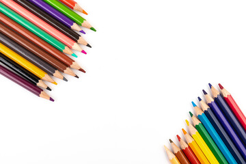 Many multicolored pencils, isolated on white background with copy space. Art and education background.