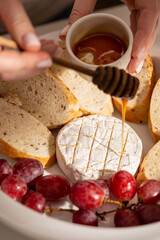 Baked brie cheese with grilled bread for dinner