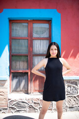 Sensual young latin woman posing in mexican town