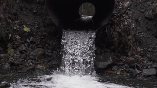 water flows from the drainage pipe. Super slow motion 1000 fps.